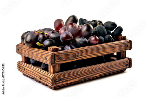 blue dark grapes mushrooms close-up in a wooden box