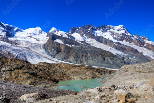 Mountain panorama with summits Castor, Pollux and Breithorn and glaciers Grenzgletscher and Zwillingsgletscher in Pennine Alps, Switzerland