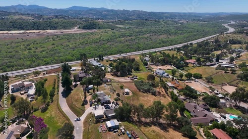 Aerial view of Fallbrook, Rainbow Crest, Rainbow Ridge with big mansion and green valley, San Diego County California