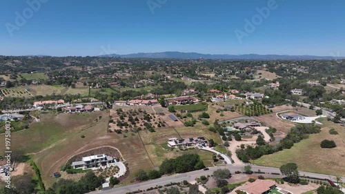 Aerial view of Fallbrook, Rainbow Crest, Rainbow Ridge with big mansion and green valley, San Diego County California