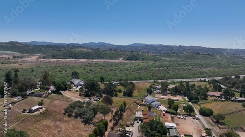 Aerial view of Fallbrook, Rainbow Crest, Rainbow Ridge with big mansion and green valley, San Diego County California