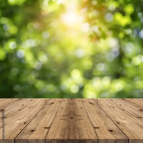 Empty wooden table top with blurred green nature background for display