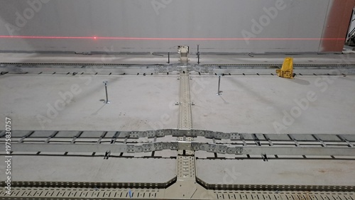 cross junction installation of cable tray and electrical tray on floor before raised access floor construction
