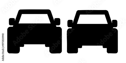 Two cars are facing forward on a road in daytime