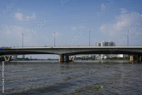 Ba Son Bridge over Saigon River with modern skyline in Ho Chi Minh City, Vietnam