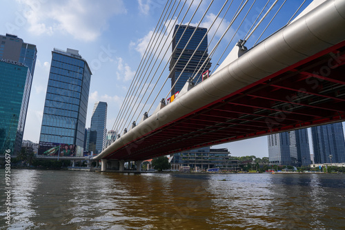Ba Son Bridge over Saigon River with modern skyline in Ho Chi Minh City, Vietnam