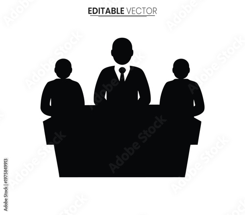Three business professionals sit at a table during a meeting a dark silhouette