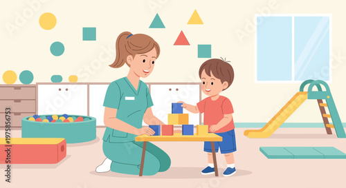 Childcare worker playing blocks with a happy child in a kindergarten classroom