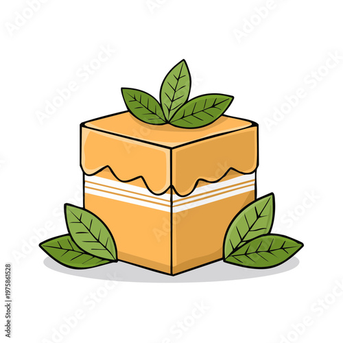 Delicious cube-shaped dessert with frosting and fresh green mint leaves decoration.