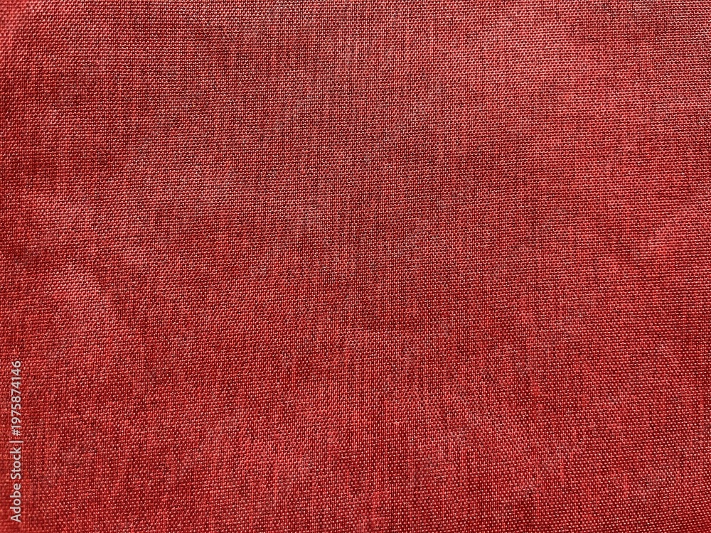 Fototapeta premium Detailed Texture of Rich Burgundy Silk Fabric with Elegant Shimmer and Smooth Weave