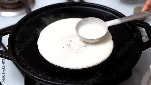 Making Delicious Dosa Batter on a Hot Griddle.