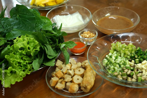 Thai-style fermented sour pork rolls served with lettuce, mint, cilantro, pickled garlic, chili, peanut, and sweet dipping sauce.