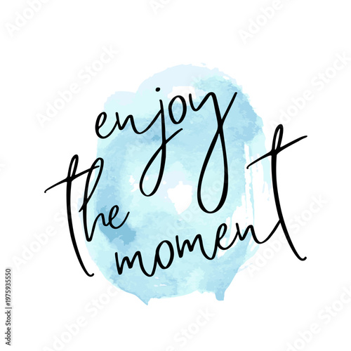 Handwritten enjoy the moment calligraphy over a soft blue watercolor background offering inspirational vibe for wall art social media print poster greeting card and desktop wallpaper