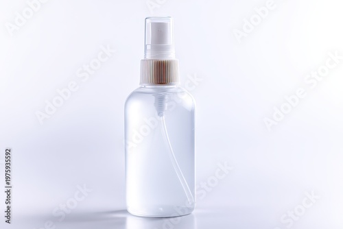 Clear Liquid Spray Bottle With White Pump Dispenser And Gold Foil Accent On Neck Isolated On White Background Studio Shot
