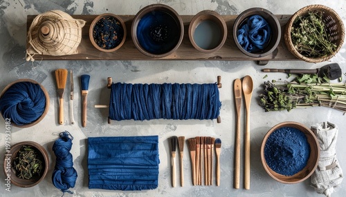 Natural indigo dyeing process with plant-based fibers and traditional tools on marble surface
