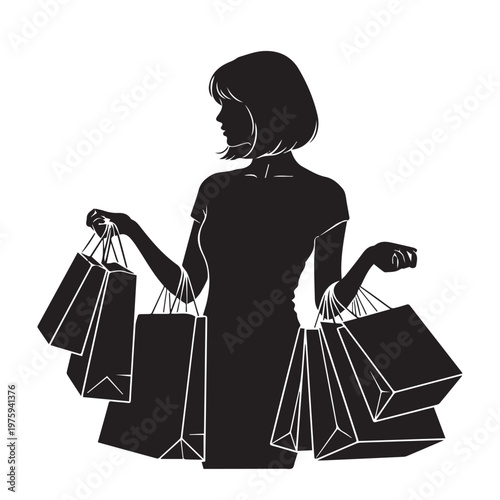 Woman holding multiple shopping bags in both hands outdoors