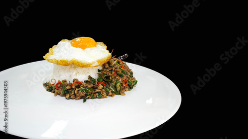 Fotografi Pad Kra Pao, Thai stir-fried minced beef with holy basil and fried egg on black background
