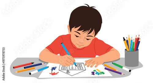 Creative young boy sitting at a table and drawing a house with a blue marker surrounded by many colorful pencils.