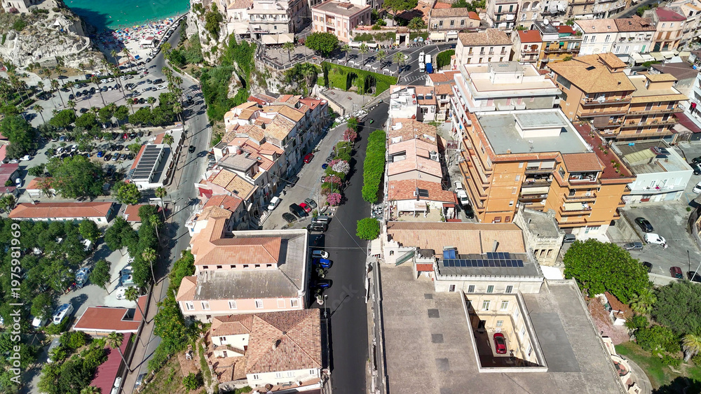 Fototapeta premium Drone perspective of Tropea in summer showing turquoise sea and scenic coastal landscape