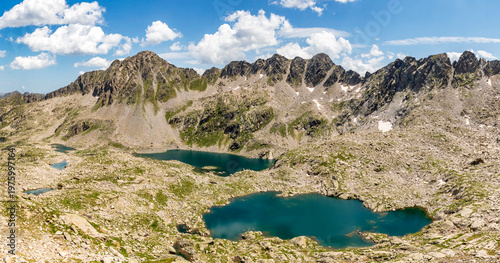 Panoramic view of the lakes Lac Deth Cap de Colomers and Estanh de Ratera with the Gran Tuc de Colomers mountain in the background, in the Circ de Colomers, province of Lleida, Catalonia, Spain

