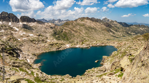 The Estanh Gelat, at  2,588 meters, is a glacial lake located on the western slope of the Circ de Colomers, in Vall d Aran, Lleida province, Catalonia, Spain