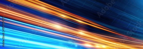 Bright, dynamic light trails in orange and blue streak across a dark background, creating a sense of speed and futuristic motion.
