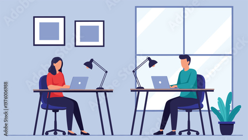 Two young professionals, a man and a woman, working on their laptops at separate desks in a modern office.