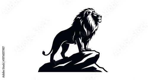 Majestic lion standing proudly on a rock in a powerful silhouette.
