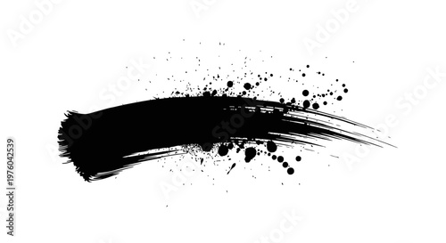 Abstract black ink brush stroke and splatter on white background.