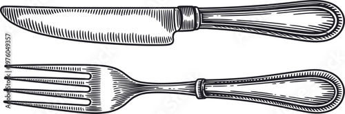 Antique silverware set featuring knife and fork for dining and culinary use.