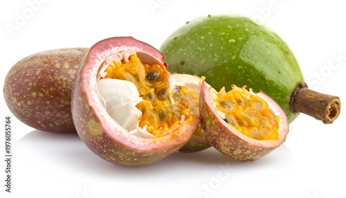 Close-up studio shot of passion fruits, one whole and others halved to display the vibrant pulpy interior