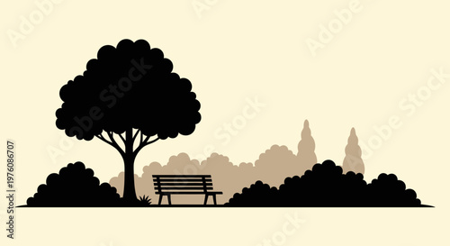 A solitary park bench sits beneath the silhouette of a large, leafy tree, surrounded by dense bushes and distant trees.