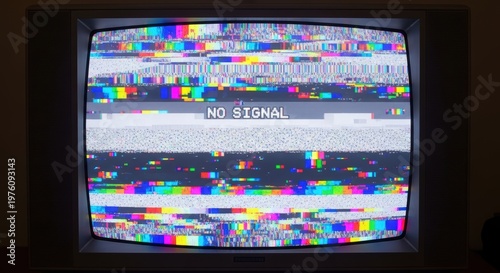 Old television displaying no signal on the screen with distorted multicolored pixels and static noise background