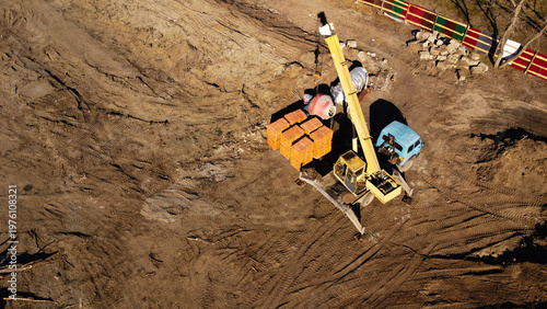 Aerial View of Construction Site with Truck Crane and Building Materials