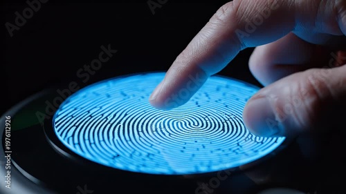 A close-up shot depicts a finger interacting with a glowing blue circular interface, suggesting a futuristic or technological interaction.