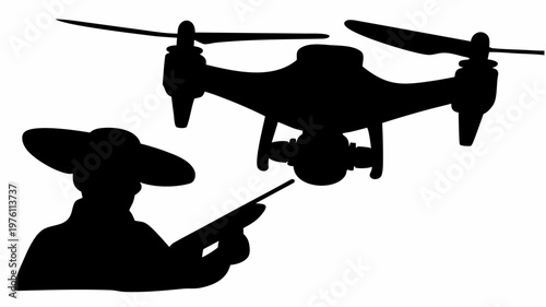 Drone casting shadow on ground controlled by person with remote