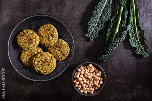 Raw vegetables on textured dark surface