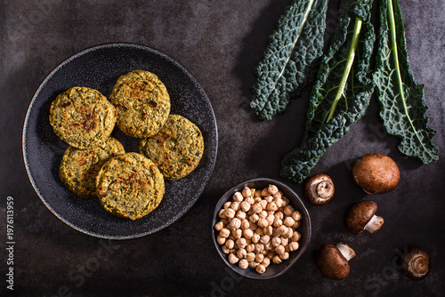 Raw vegetables on textured dark surface