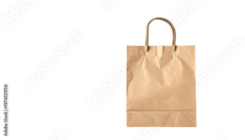 A close-up shot of a brown paper shopping bag with sturdy handles, set against a solid black background. The bag is crumpled