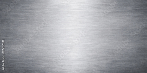 Industrial silver brushed metal texture background with a polished stainless steel plate pattern on a shiny metallic grey aluminum surface sheet backdrop