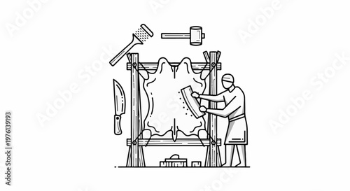 Person scraping hide on frame with tools