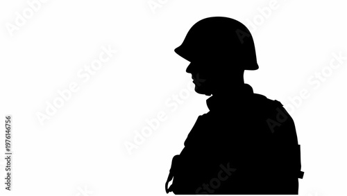 Silhouette of a soldier standing still in profile view with helmet arms crossed against a plain white background symbolizing strength and resilience