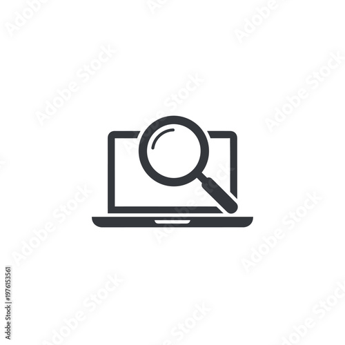 Laptop with magnifying glass on screen.