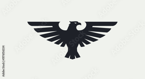 Black silhouette of eagle spreading wings.