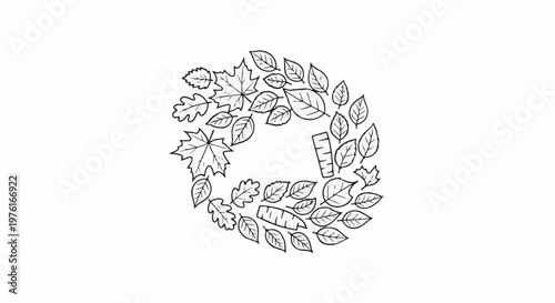 A circular arrangement of various autumn leaves and small carved wooden objects