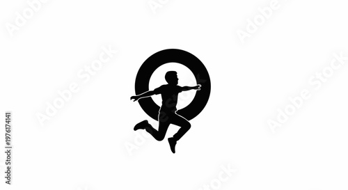 Silhouette of a person jumping through a circular ring