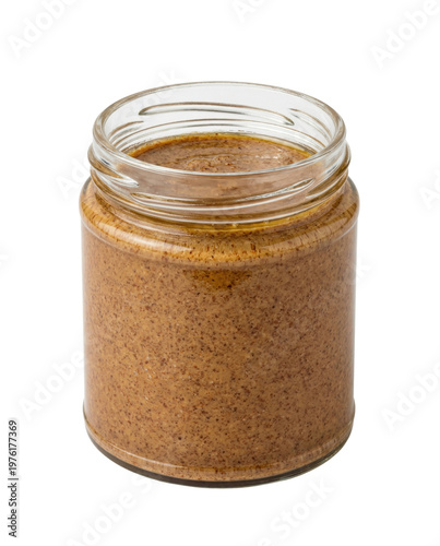 Photos Open glass jar of creamy nut butter isolated