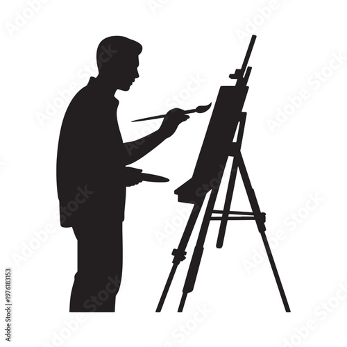 Silhouette of an artist painting at an easel with a brush