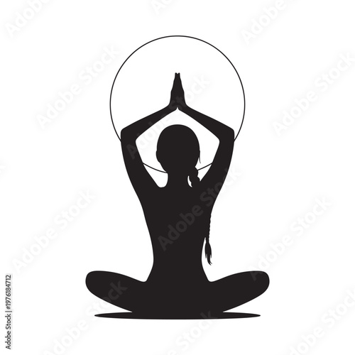 Silhouette of a woman in a lotus position practicing yoga meditation