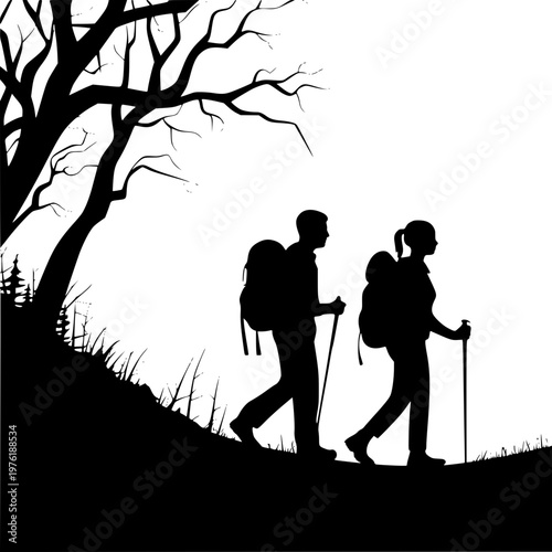 Silhouette of a couple hiking with backpacks and trekking poles under a bare tree